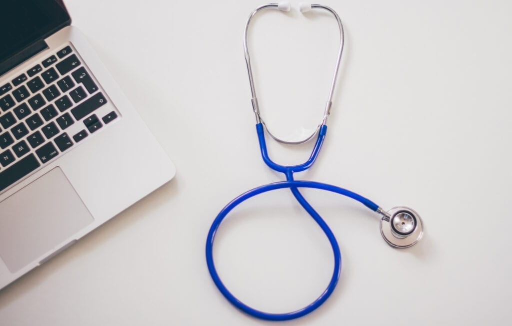 Image of stethoscope and laptop